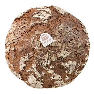 ein dunkles rundes Mehrkornbrot mit leicht bemehlter, angerissener Brotkruste