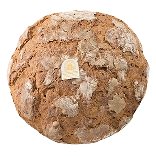 ein rundes helleres Mehrkornbrot mit leicht bemehlter, angerissener Brotkruste