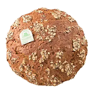ein rundes Mehrkornbrot mit stellenweise Haferflocken auf der Kruste