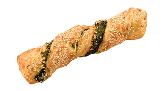 ein in sich verdrehtes Sesam-Gebäckstück mit Spinatstreifen