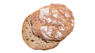 Ein dunkleres Vollkornbrötchen mit eingebackenem Mehl auf der Oberseite